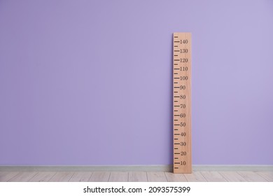 Big Ruler For Height Measuring Near Color Wall