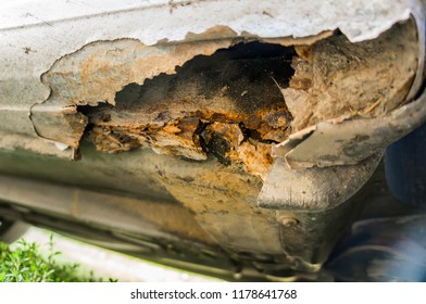 Big Rust Hole In A Car