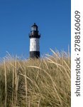Big sable Point lighthouse at sunset in Ludington State Park along Lake Michigan, Michigan USA. Scenic nature landscape with beach and sand dunes. A peaceful tranquil coastal landscape.
