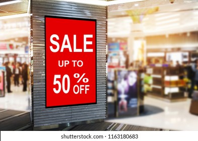 big sale 50% mock up advertise billboard or advertising light box in department store shopping mall or airport, special offer, commercial, marketing and advertisement concept