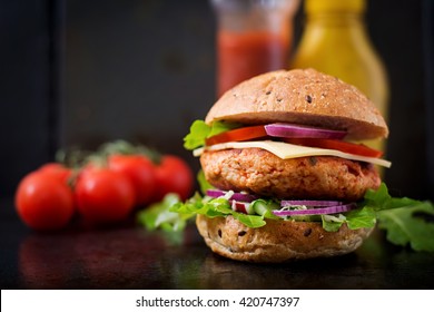 Big Sandwich - Hamburger With Juicy Chicken Burger, Cheese, Tomato,  And Red Onion On Black Background