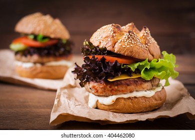 Big sandwich - hamburger with juicy turkey burger, cheese, tomato and tartar sauce - Shutterstock ID 404462080