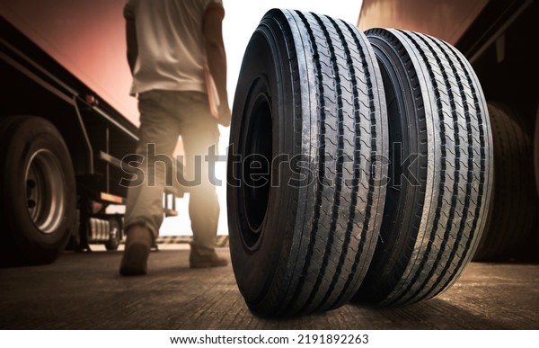 Big Semi Truck Wheels Tires.Truck Spare Wheels
Tyre. Truck Drivers Checking Safety Driving. Industry Road Freight
Truck Transport.