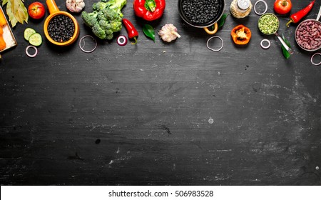 Big set organic food. Fresh raw vegetables. On a black chalkboard. - Powered by Shutterstock