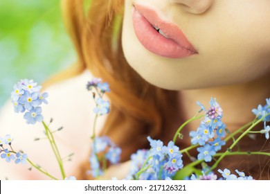 big sexy lips girls with blue flowers in her hands