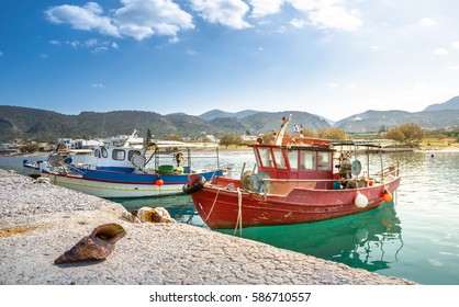 Big Shell In Front Of Traditional Fishing Boats, Milatos, Crete, Greece.