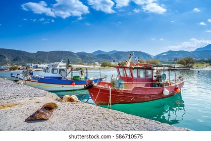 Big Shell In Front Of Traditional Fishing Boats, Milatos, Crete, Greece.