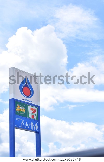 Big sign in front of PTT petrol station on\
blue sky and white clouds background.PTT Public Company Limited is\
a Thai state-owned SET-listed oil and gas company.Sep 9,2018 :\
Chiang Mai,Thailand.