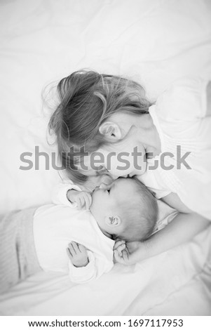 Similar – Image, Stock Photo happy mother and baby playing at home in bedroom
