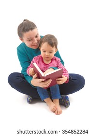 Big Sister Reading To Her Little Sister A Story