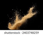 Big size Sand flying explosion, Golden grain wave explode. Abstract cloud fly. Yellow colored sand splash throwing in Air. Black background Isolated selective focus blur