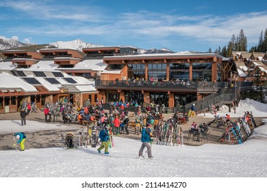 Big Sky, MT, US-January 23, 2022: Crowd Of People Preparing To Ski Near Ski Lodge At Famous Western US Ski Resort.