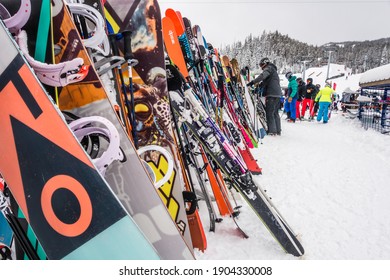 Big Sky, MT,US-Feb 7 2020: Many Pairs Of Skis Are Leaned Up On A Rack At A Ski Resort In Winter.