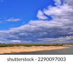 Big sky over Burnham Overy Staithe, North Norfolk coast, East Anglia. Ample copy space. High quality photo