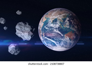 Big And Small Asteroids Near Planet Earth. Concept A Potentially Hazardous Object (PHO). Asteroids In Outer Space Near Earth Planet.  Elements Of This Image Furnished By NASA.