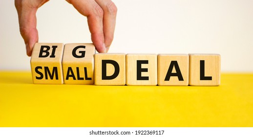 Big or small deal symbol. Businessman turns a wooden cube and changes words 'small deal' to 'big deal'. Beautiful yellow table, white background, copy space. Business and big or small deal concept. - Shutterstock ID 1922369117