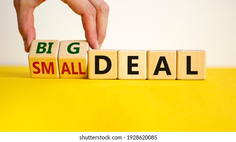 Big or small deal symbol. Businessman turns a wooden cube and changes words 'small deal' to 'big deal'. Beautiful yellow table, white background, copy space. Business and big or small deal concept. - Shutterstock ID 1928620085