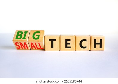 Big Or Small Tech Symbol. Turned Wooden Cubes And Changed Concept Words Small Tech To Big Tech. Beautiful White Table White Background, Copy Space. Business And Big Or Small Tech Concept.