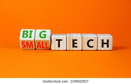 Big Or Small Tech Symbol. Turned Wooden Cubes And Changed Concept Words Small Tech To Big Tech. Beautiful Orange Table Orange Background, Copy Space. Business And Big Or Small Tech Concept.