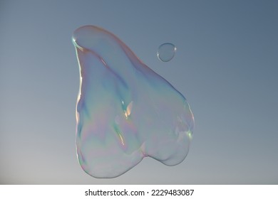 Big soap bubble. Colorful soap bubble on the blue sky.