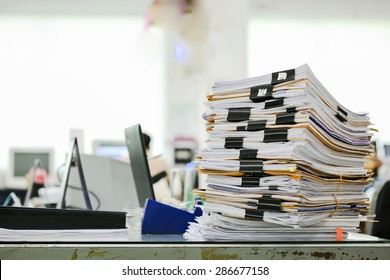 Big Stack Of Business Report Paper Files With Black Clips  