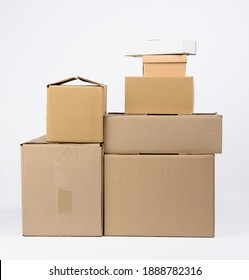 Big Stack Of Closed Cardboard Brown Paper Boxes On White Background, Moving Concept