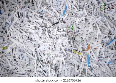 Big stack of shredded documents to protect confidential information, safety is first concept, background, top view, closeup