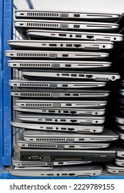 Big stacks of discarded laptops, notebooks on a trolley - Shutterstock ID 2229789155