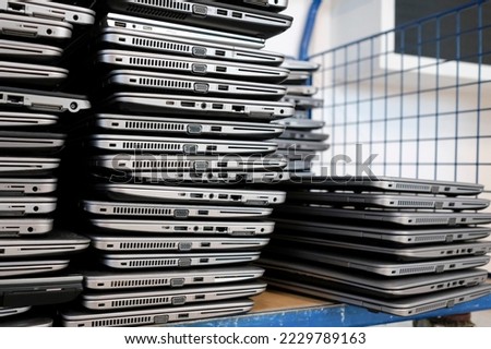 Similar – Image, Stock Photo Big stacks of discarded laptops, notebooks on a trolley