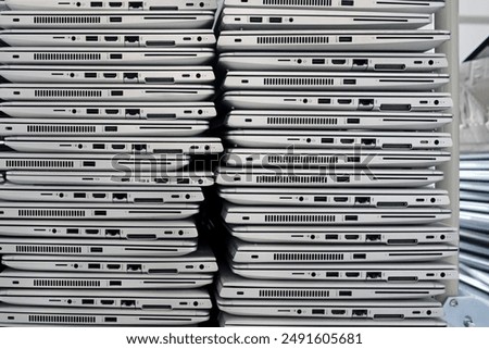 Similar – Image, Stock Photo Big stacks of discarded laptops, notebooks on a trolley