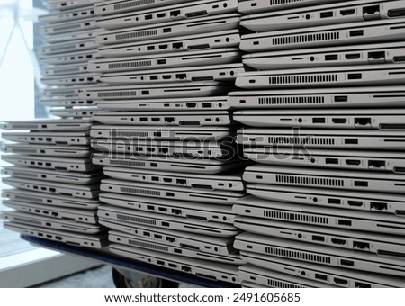Similar – Image, Stock Photo Big stacks of discarded laptops, notebooks on a trolley