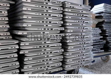 Similar – Image, Stock Photo Stack of laptops in the storage room of a company