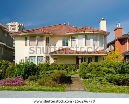 Big standard middle class house in a residential neighborhood. Vancouver, Canada