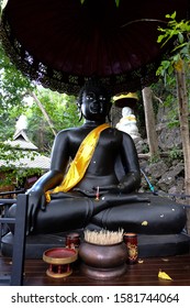 Big statue black buddha in Wat Chaloem Phra Kiat Phrachomklao Rachanusorn located on Doi Pu Yak place in Lampang