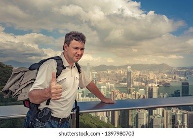 Big Strong Guy With Backpack Pose On Victoria's Peak, Men Showing Big Finger To The Camera