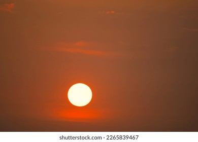 Big sun on sunset sky, beautiful sunset zoom the sun photo, sunset telephoto lens.