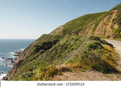 Big Sur Road Trip. Scenic California State Route 1. Rocky Cliffs With Native Plants, And Beautiful Turquoise Colored Pacific Ocean.