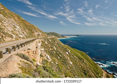 Big Sur Road Trip. Scenic California State Route 1. Rocky Cliffs With Native Plants, And Beautiful Turquoise Colored Pacific Ocean.