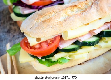 Big tasty sandwich with cheese,ham and vegetables.