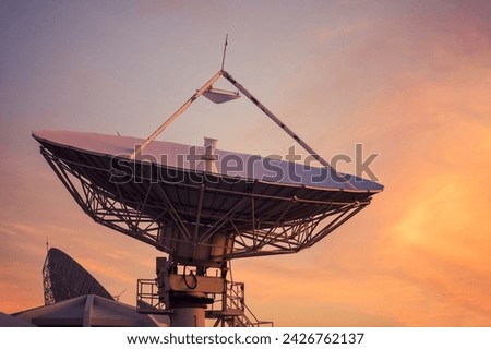Big telecommunication  satellite dish or Radio Telescope in evening with twilight sky at dusk.