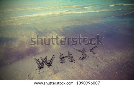 big text WHY written on the beach