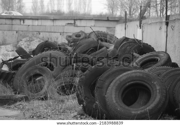 Big tractor\
tires. Yard of an abandoned\
factory