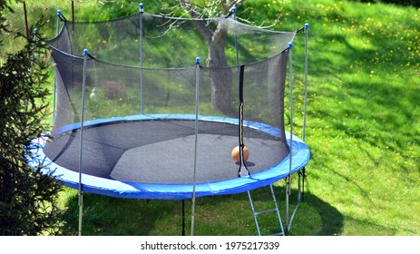 Big trampoline for children and adults. Outdoor Trampoline with safety net with Zipper entrance.  - Shutterstock ID 1975217339