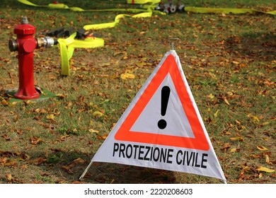 big triangle with exclamation mark and text in Italian which means CIVIL PROTECTION and a fire hydrant