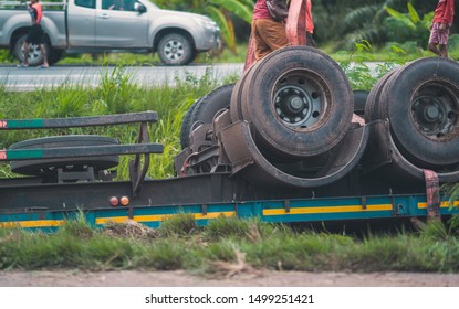 Big Truck Accident Breakdown On Road, It Broken Wheel Tire On Highway And Emergency Service For Safety And Repair On Blurred Other Car On Road Background