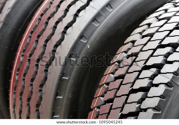 Big truck wheel a black\
tires closeup