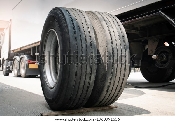 A Big Truck Wheels and Tires. Truck Spare\
Wheels Tyre Waiting For to Change. Vehicle Parts, Trailer\
Maintenace and Repairing.\
