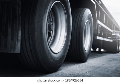 A Big Truck Wheels And Tires Of Trailer Truck. Semi Truck Parking. Industry Freight Truck Transportation.