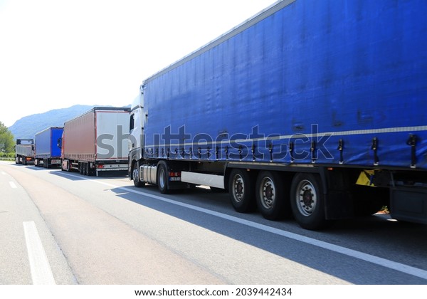 big trucks stopped in the\
highway