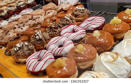 Big variety of doughnuts flavors. Delicious donuts showcase. 